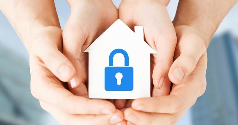 Hands protecting a house, showing privacy for high-profile families